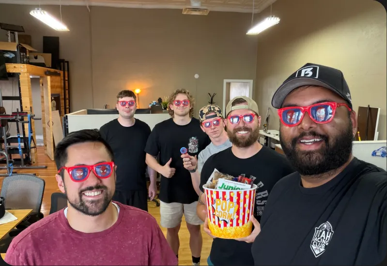 RedSky team members celebrating with popcorn at the office