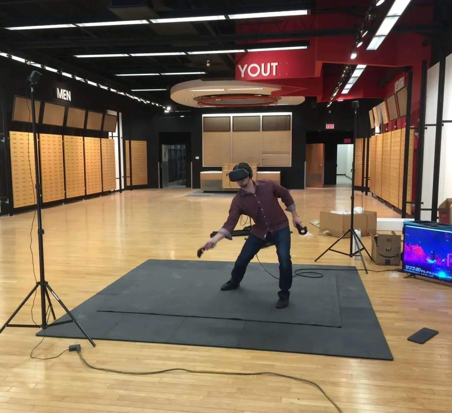 RedSky founder testing a VR headset inside the original VR arcade